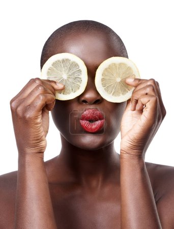 Photo for Black woman, kiss and lemon skincare in studio for organic dermatology routine, youth or wellness. White background, face and African model with facial fruit, diet food and eyes product for beauty. - Royalty Free Image