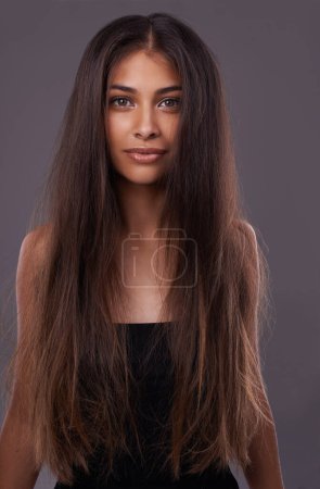 Photo for Portrait, woman or messy hair for haircare, beauty or texture change for growth, health or scalp in studio. Female model, damaged or long as haircut, weak or split end in treatment on grey background. - Royalty Free Image