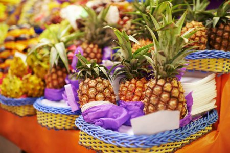 Photo for Pineapple, fruit and fresh produce at farmer market, vitamins and healthy food for groceries. Retail, sales and merchandise of sweet tropical products, fiber and vitamin c from local producer. - Royalty Free Image