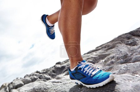 Photo for Closeup, running shoe and rocky terrain or nature, fitness and exercise for health. Footwear, trail and cardio jogging for marathon training, fun and wellness on off road and cross country routes. - Royalty Free Image