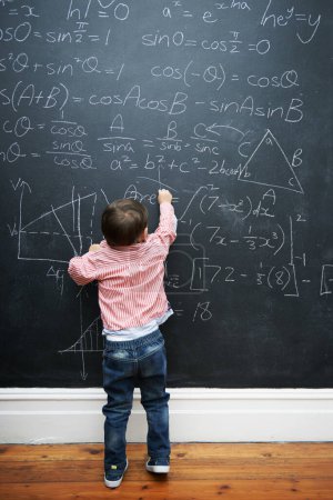 Photo for Child, math and blackboard with writing in classroom for knowledge, development and young genius in school. Kid, numbers and formula on chalkboard with learning for education, growth and solution. - Royalty Free Image