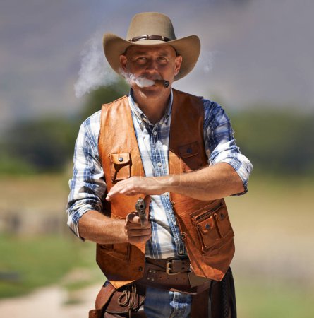 Photo for Cowboy, portrait and aim gun to shoot for standoff or gunfight in duel for wild western culture in Texas. Male gunslinger or outlaw, revolver and confrontation for defense or conflict with battle. - Royalty Free Image
