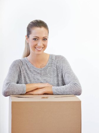 Photo for Portrait, moving and woman with a box, home and model isolated on a white studio background. Face, person and girl with property and real estate with renovation and achievement with package or parcel. - Royalty Free Image