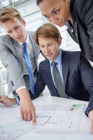 Photo for Architecture, collaboration and planning with business people in office together for design. Building plans, blueprint and employee group of professional developer men and women meeting in workplace. - Royalty Free Image