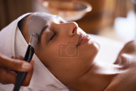 Photo for Woman, relax and mask in spa for skincare, beauty and cosmetic treatment for break or peace. Young person and natural for holistic therapy for wellness, clean and hygiene with product for facial. - Royalty Free Image