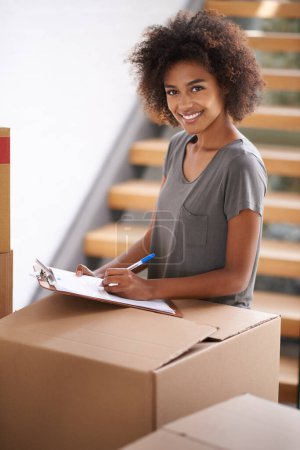 Photo for Courier, portrait and delivery box with black woman sign for package with a smile from shipping order. House, happy and shipment with signature with cardboard parcel from moving company with new home. - Royalty Free Image