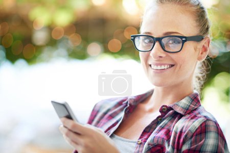 Photo for Woman, portrait and internet with phone outdoor for communication, social media and mobile chat with smile. Person, face and happy with smartphone for text message, online scroll and email with bokeh. - Royalty Free Image