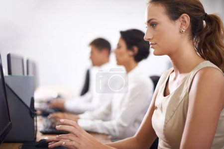 Photo for Business woman, computer and typing with team in call center for email, support or online service at office. Female person, consultant or employee working on desktop PC with group or agency for help. - Royalty Free Image