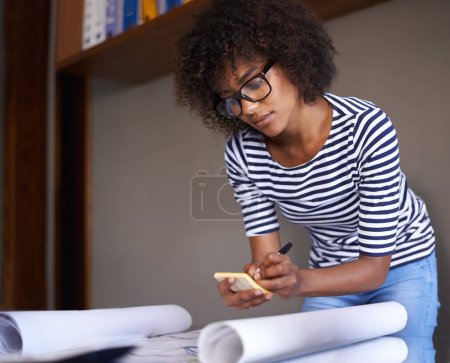 Photo for Woman, home and writing on notepad with plans, business and remote work from living room. Strategy, architect and African female person serious and concentrated for architecture by black worker. - Royalty Free Image