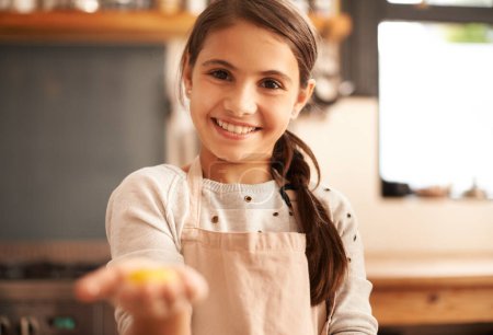 Photo for Girl, portrait and dough in hand for baking, pastry and prepare flour mixture in kitchen. Female person, kid and smile for learning in home, child development and education for cookie skill or cake. - Royalty Free Image
