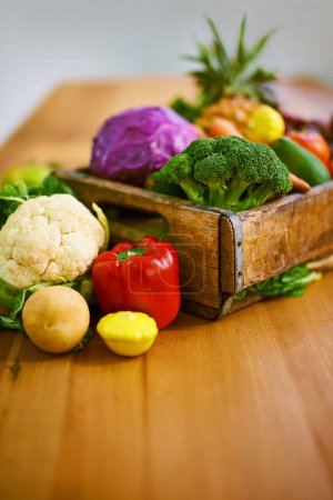 Photo for Table, crate and fresh or organic vegetables for nutrition or wellbeing, ripe and raw ingredients for sustainability or eating. Agriculture, produce and healthy diet for vegan, wellness and protein - Royalty Free Image