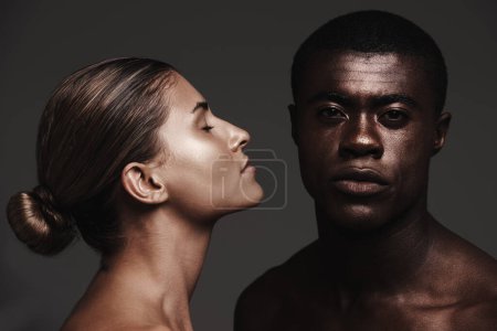 Photo for Interracial couple, face or love in skincare, dermatology or beauty as health, support or wellness. Black man, woman or glow as creative, aesthetic or diversity in bonding together on grey background. - Royalty Free Image
