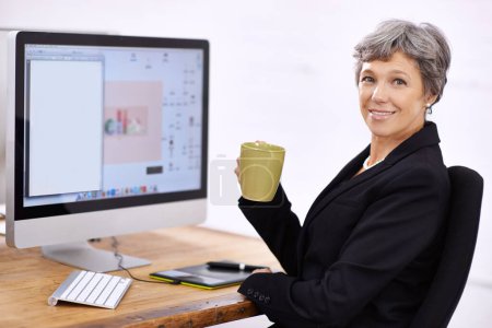 Business woman, portrait and senior professional in office at computer with coffee and email. Tech, desk and happy executive with online job and confidence from startup career with operations manager.