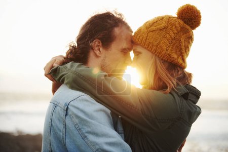 Photo for Hug, outdoor and couple with love, sunshine and lens flare with holiday for embrace or honeymoon. Romance, relationship or man with woman or happiness with vacation or journey with journey or date. - Royalty Free Image