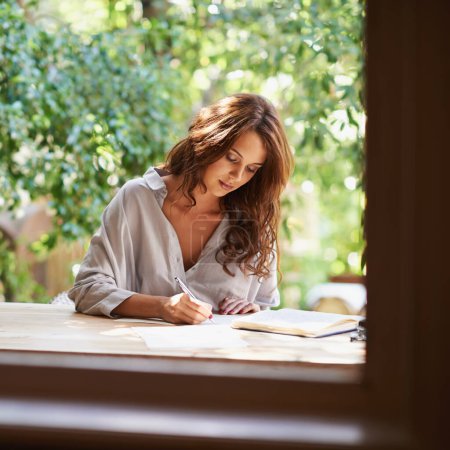 Photo for University student, woman and write notes to study for revision, exam preparation at home. Female person outdoor and diary with test or assignment deadline and schedule for distance learning. - Royalty Free Image