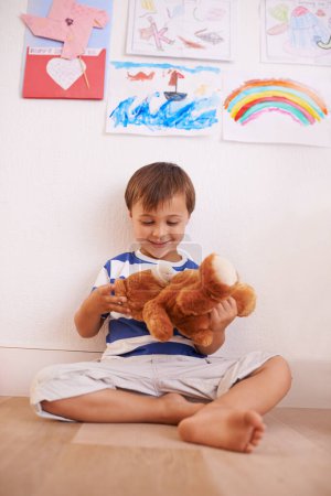 Photo for Floor, smile or child with teddy bear for playing or development and growth in home in playroom. Happiness, activity and playful with a fluffy toy, young toddler kid and fun games for entertainment. - Royalty Free Image