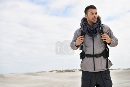 Photo for Backpack, travel or fitness man in desert for adventure, journey or resort, location and exploration. Outdoor, holiday or male backpacker in Egypt for sand dunes walking, wellness or hiking in nature. - Royalty Free Image