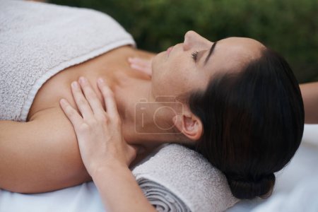 Photo for Spa, woman and hands with massage for wellness at resort, luxury hotel and vacation for relax and therapeutic pamper. People, masseuse or body care with shoulder treatment, hospitality or zen outdoor. - Royalty Free Image