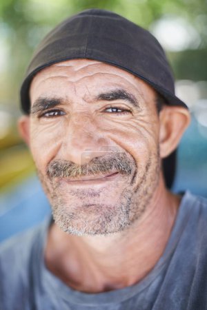 Photo for Portrait , smile and happy senior man in nature, outdoors and wrinkles from sunlight exposure. Grandfather, face and aged male from Brazil , closeup and local rainforest natural and retired. - Royalty Free Image