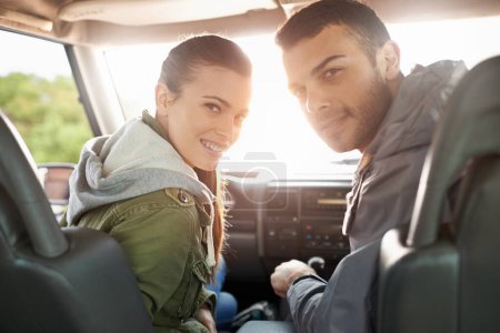 Photo for Couple, smile and portrait in car for road trip, travel or journey in vehicle and outdoor for holiday. Man, woman and happy in seat with radio and jacket for driver, passenger and safety together. - Royalty Free Image