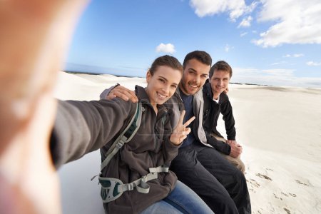 Photo for Friends, desert and selfie with smile for adventure in happiness for holiday, road trip and travel together. People, memory and excited in sand dunes for vacation or break with bonding for fun. - Royalty Free Image