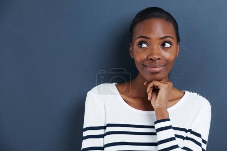 Photo for Thinking, idea and black woman with mockup in studio for planning, questions or asking on blue background. Why, curious and African female model with emoji guess for problem solving or brainstorming. - Royalty Free Image