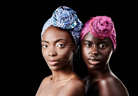 Photo for African, scarf and portrait of women in studio for wellness, health and traditional hairstyle. Culture aesthetic, natural beauty and people with accessories, cosmetics and makeup on black background. - Royalty Free Image