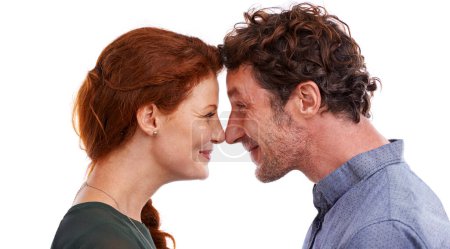 Photo for Couple, nose touch and love in studio, romance and smile for relationship on white background. Happy people, commitment and trust in security of marriage, bonding and affection for anniversary. - Royalty Free Image