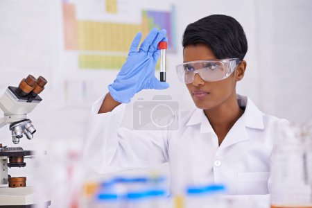Photo for Blood, dna and scientist with test tube in laboratory for scientific research or experiment. Medical, science and professional woman researcher with pharmaceutical dna in glass vial for medical study. - Royalty Free Image
