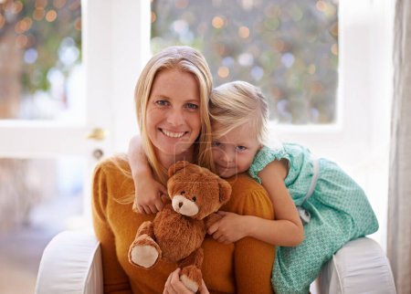 Photo for Happy mama, portrait and hug with child or teddy bear for love, care or support together in living room at home. Face of mom, kid or daughter with smile for embrace, affection or mothers day at house. - Royalty Free Image