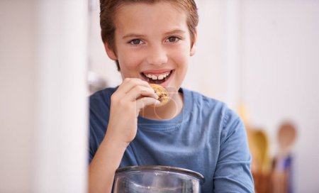 Photo for Eating, cookies and happy portrait of child in home with glass, container or jar of sweets in kitchen. House, snack and kid craving a taste of sugar from addiction to biscuit and unhealthy food. - Royalty Free Image