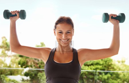 Photo for Woman, portrait and dumbbell training or outdoor exercise on balcony for fitness, sports or performance. Female person, face and arm strength for summer weightlifting, physical activity or workout. - Royalty Free Image
