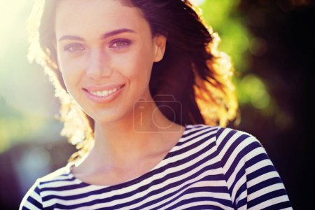 Photo for Person, portrait and smile with nature, sunset and park for happiness and wellness. Woman, joy and sunshine with closeup, glow and happy for summer relax and adventure outside in garden with trees. - Royalty Free Image