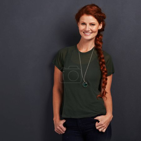 Photo for Portrait, ginger and happy woman in studio for fashion isolated on dark background mockup space. Confidence, smile and person with red hair in casual clothes, tshirt or stylish on backdrop in Ireland. - Royalty Free Image