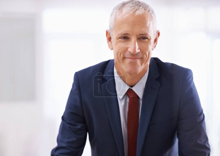 Photo for Smile, face and mature businessman, ceo or senior manager at corporate startup office with mockup. Relax, confidence and business owner, boss or happy entrepreneur at professional agency with pride. - Royalty Free Image