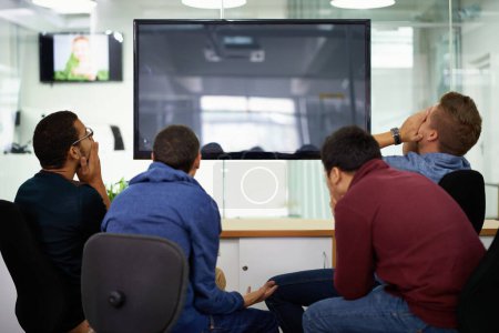Photo for Men, group and mockup with tv in office for failure with friends together for streaming entertainment. People, unhappy and frustrated emotion for blackout or power outage, screen and darkness - Royalty Free Image