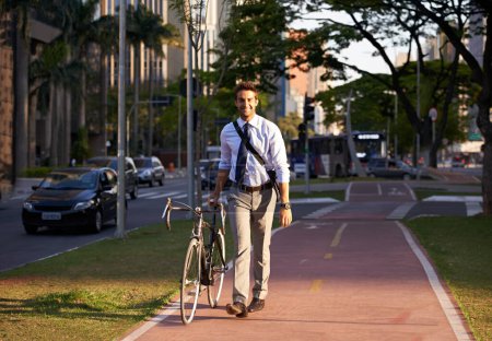 Photo for Bicycle, city and portrait of happy businessman for travel, morning commute and walking to work. Professional, urban town and person with bike for cycling, sustainable and eco friendly transport. - Royalty Free Image