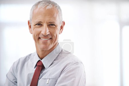 Photo for Smile, portrait and senior business man, ceo or mature manager at corporate startup office. Relax, confidence and happy professional, boss or entrepreneur at agency with pride, mockup and space. - Royalty Free Image