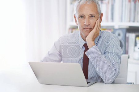 Photo for Portrait, laptop and senior businessman in office thinking, planning or checking email, review or social media feedback. Face, calm or old male executive with pc for online, research or communication. - Royalty Free Image
