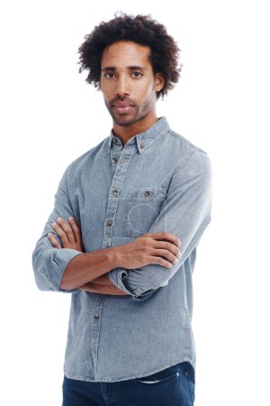 Photo for Fashion, crossed arms and portrait of man in studio with casual, trendy and denim shirt outfit. Serious, confident and young male person from Colombia with cool style isolated by white background - Royalty Free Image