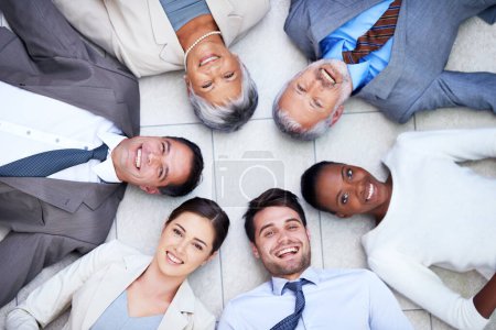Photo for Floor, circle and portrait of team with smile for support, collaboration and solidarity. Professional employees, happy and diversity in office with trust, unity and partnership together from above. - Royalty Free Image