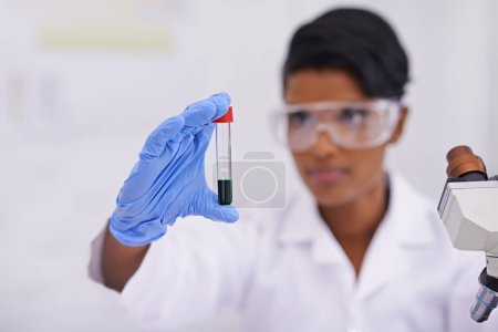 Photo for Blood, hand and scientist with test tube in laboratory for scientific research or experiment. Microscope, science and woman researcher with pharmaceutical dna in glass vial for medical study - Royalty Free Image