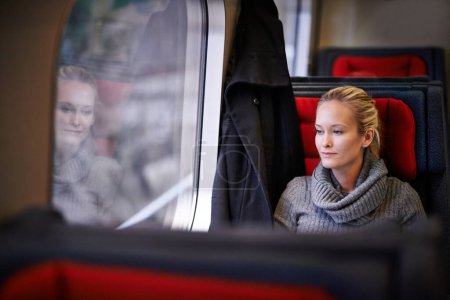 Photo for Woman, travel and thinking on train for vacation with adventure, trip and leisure for journey in France. Female person, commute and holiday on public transport as tourist for break and destination. - Royalty Free Image