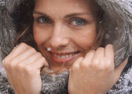 Photo for Woman, snow and portrait with fur hood and winter fashion for cold weather and climate in Iceland. Travel, smile and happy female person on a holiday freezing in nature with frost outdoor on vacation. - Royalty Free Image