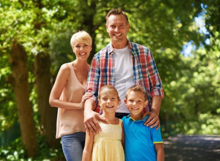 Photo for Happy, portrait and family in park on holiday with care and support from parents for children. Mother, father and kids smile in forest in summer or adventure on vacation and relax together in woods. - Royalty Free Image