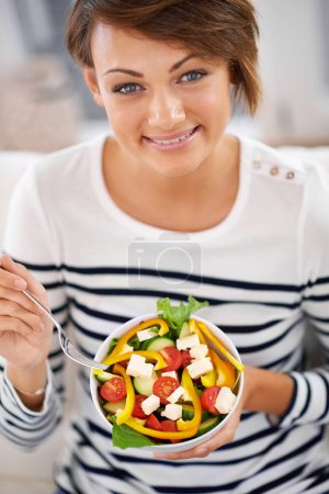 Photo for Woman, salad and healthy vegetables in portrait for diet with detox, breakfast and lunch at home. Young person eating food, lettuce and green fruit or vegan meal in a bowl for nutrition and wellness. - Royalty Free Image