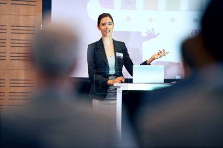 Photo for Business woman, talking and presentation with projector screen, conference or workshop with laptop for slideshow. Corporate training, seminar and speaker with info, audience and professional speech. - Royalty Free Image