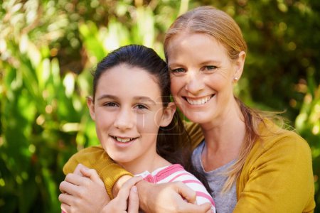 Photo for Girl, mother and hug in portrait in park with smile, support and outdoor bonding in nature together. Women, family and face of happy teen with mom in garden with love, weekend and trees in backyard. - Royalty Free Image