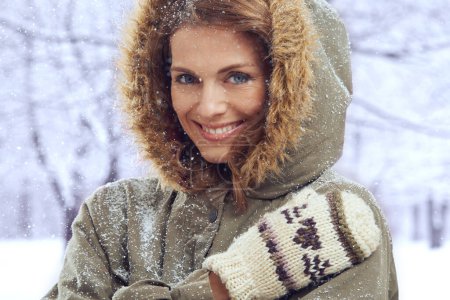 Photo for Happy woman, smile and portrait in nature with snow, winter season with fur coat for fashion, good mood and outdoor. Peace, calm and cold with comfort in jacket for weather, ice or frozen with travel. - Royalty Free Image