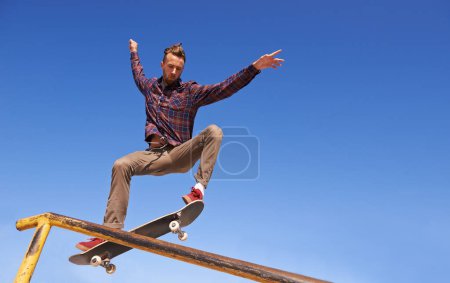Photo for Fitness, energy and man with skateboard, jump or rail balance at a skate park for stunt training. Freedom, adrenaline and gen z male skater with air, sports or skill practice, exercise or performance. - Royalty Free Image